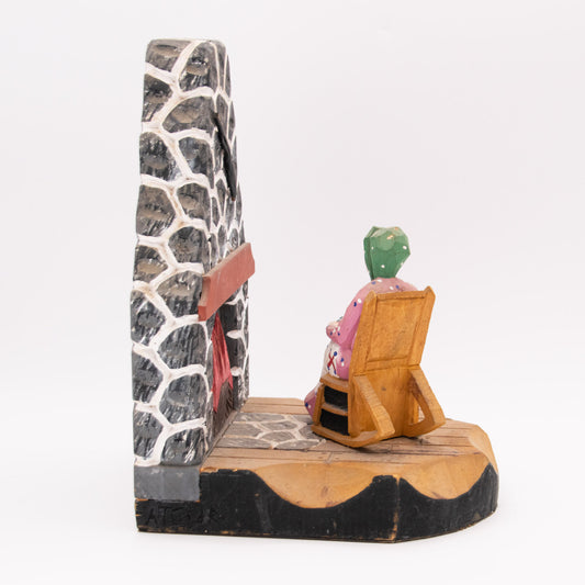 Chaise berçante devant  le feu