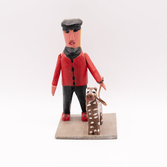 Homme en rouge promenant son dalmatien brun