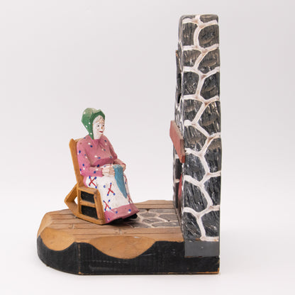 Chaise berçante devant  le feu